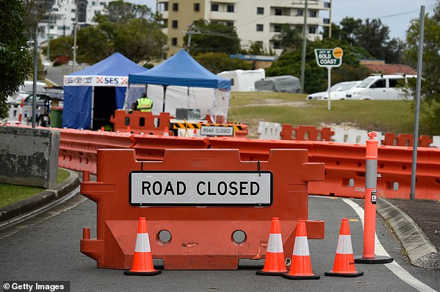 31047600-8547661-Barricades_have_been_installed_along_some_of_Coolangatta_s_stree-a-3_1595404242678.jpg,0