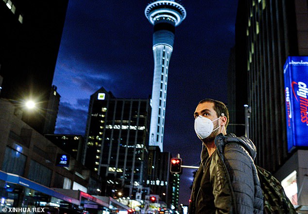31880762-8621165-A_man_wearing_a_face_mask_is_seen_in_downtown_Auckland_New_Zeala-m-24_1597268261490.jpg,0