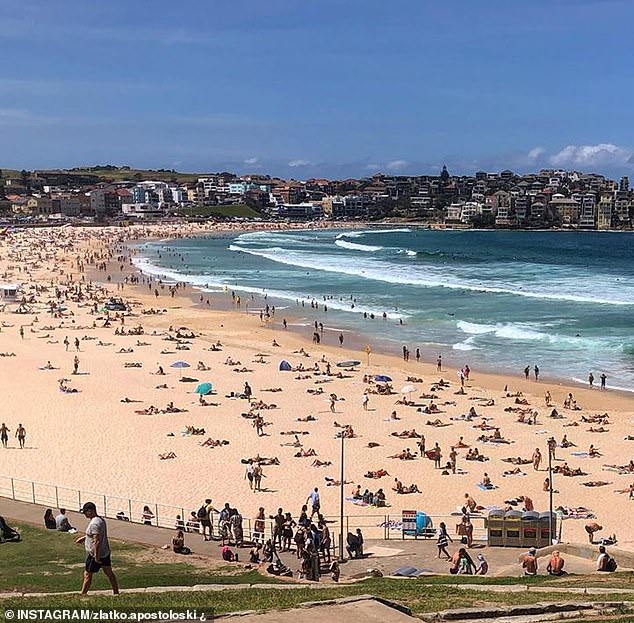 32535580-8676557-Large_crowds_were_seen_at_Sydney_beaches_on_Saturday_and_lifegua-m-43_1598704611032.jpg,0