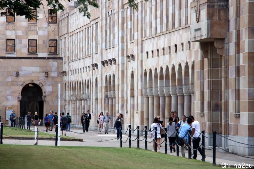 Students walk through the Great Court at the University of Queensland.