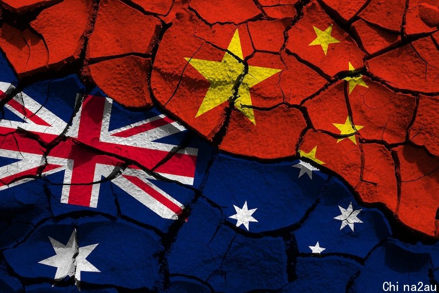 A composite of the Chinese and Australian flags on cracked ground.