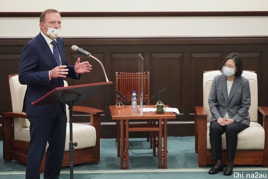 Former PM Tony Abbott gestures while speaking at an event with Taiwanese president Tsai Ing-wen