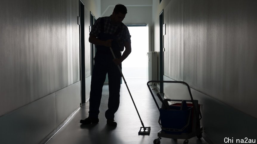 A silhouette of a cleaner mopping a floor.