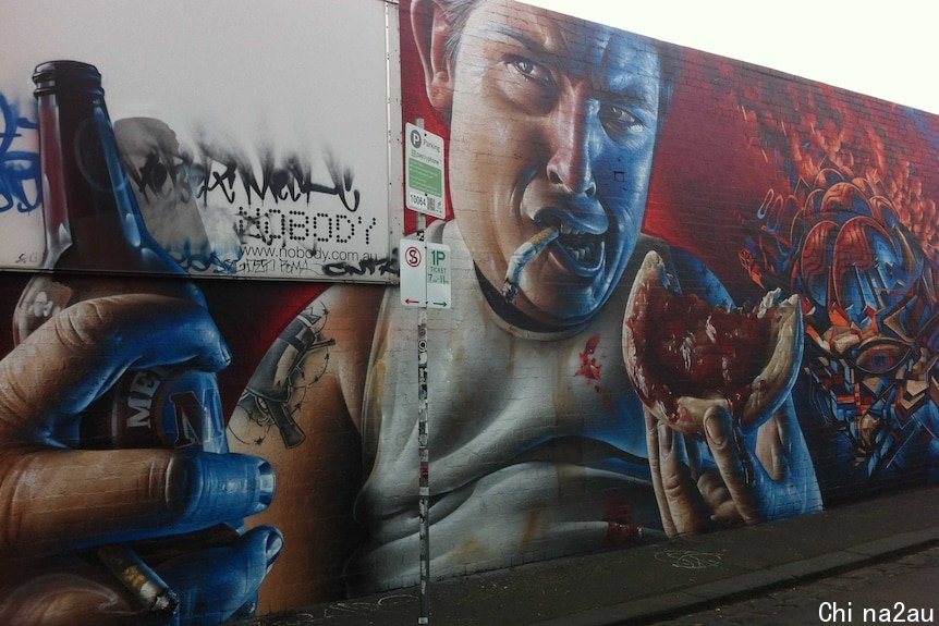 A mural depicting a man drinking beer, smoking cigarettes and eating a meat pie.