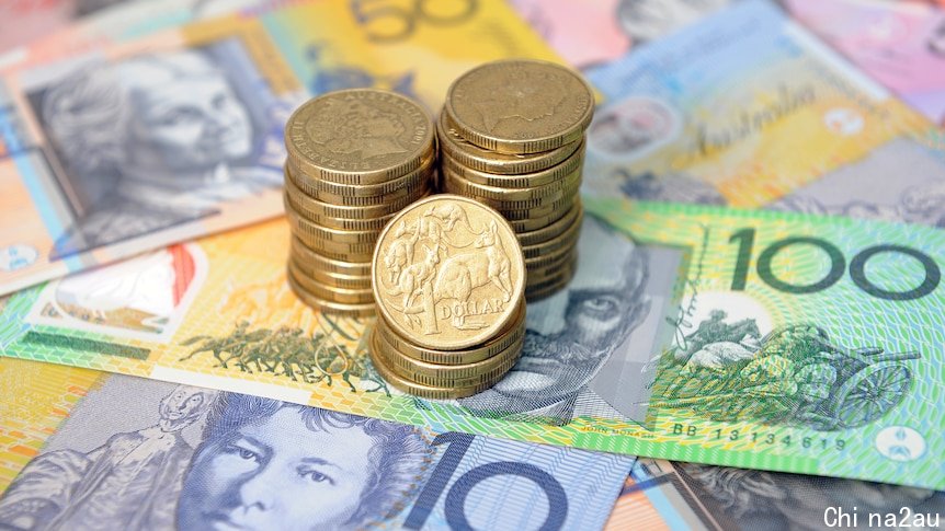 Picture of Australian one dollar coins stacked on top of note currency