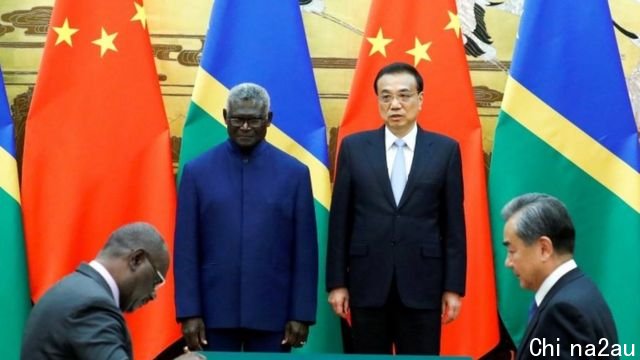 Solomon Islands Prime Minister Manasseh Sogavare, Solomon Islands Foreign Minister Jeremiah Manele, Chinese Premier Li Keqiang and Chinese State Councillor and Foreign Minister Wang Yi attend a signing ceremony at the Great Hall of the People in Beijing