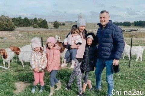 Bashir Naim and family with goats in the background