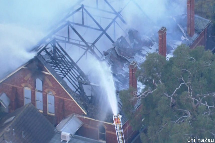 Smoke rises from a burning church