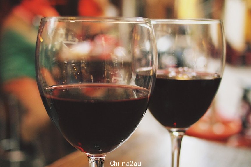 Two glasses of red wine.