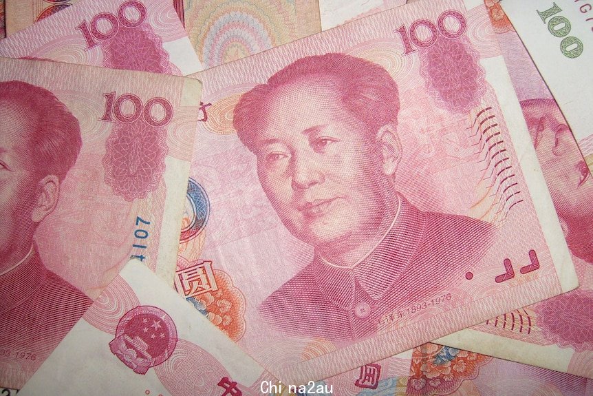 Red 100 yuan note of China's Renminbi currency with the late Chairman Mao's face.