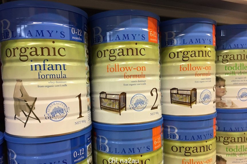 Tins of infant formula sitting on the shelf