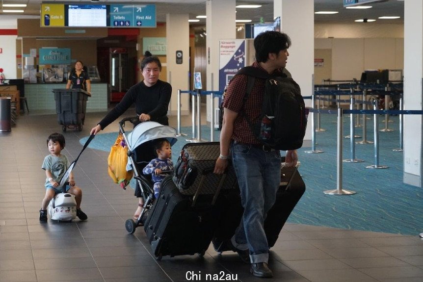 Australians evacuated from Wuhan head home from Darwin airport after their quarantine.