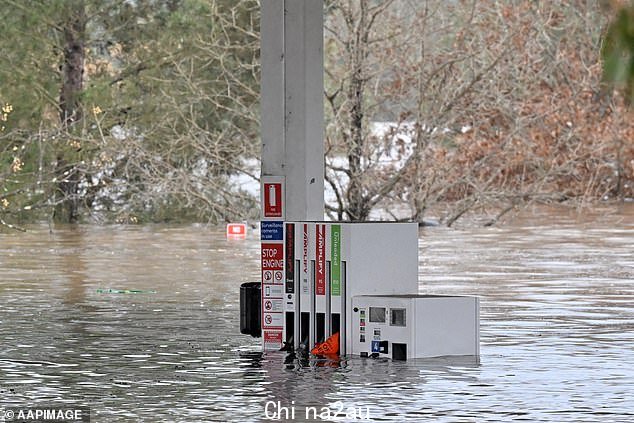 A submerged petrol station as floodwaters continued to rise in Camden on Sunday