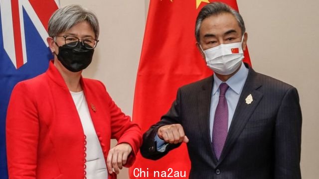 Penny Wong and Wang Yi bump elbows