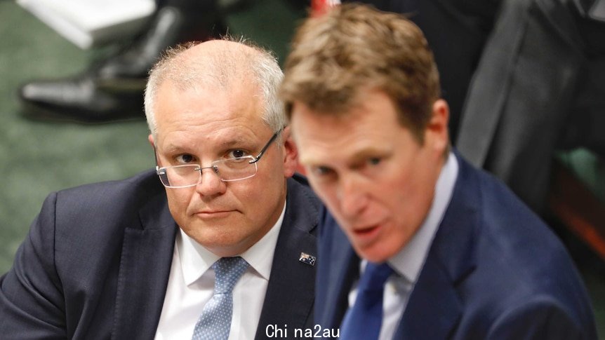 Scott Morrison watches on as Christian Porter speaks in the House of Representatives