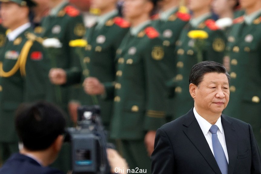 A man stands in the front of soldiers