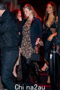 Kate Moss, 50, covers up floral dress and blazer as she parties with Emma Weymouth, 38, after making a surprise debut in the Victoria